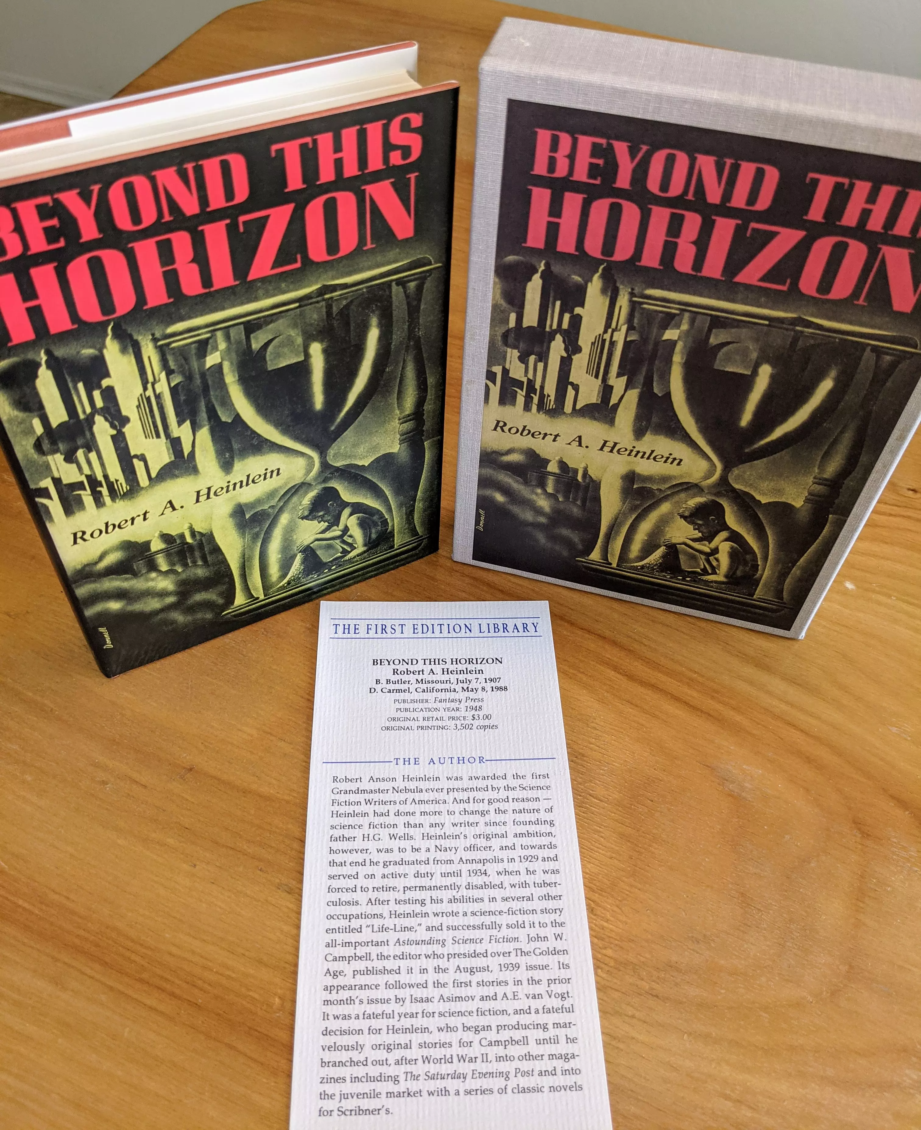 Pristine, unread facsimile first edition of Robert A. Heinlein's Beyond This Horizon, produced by The First Edition Library. This copy is from a single-owner private collection, stored in dust-free bookcases in a dry climate, ensuring its preservation in as-new condition. The facsimile is housed in an original slipcase, which, like the dust jacket, is in excellent, fine condition
 - 
The cover art, illustrated by Robert Breck, features a striking design: bold red title text BEYOND THIS HORIZON dominates the upper portion, while the lower section depicts a futuristic cityscape juxtaposed with a large hourglass. Inside the hourglass, a man is seated and reading, suggesting themes of time and contemplation central to the novel
 - 
This edition includes a publisher's bookmark with detailed notes, providing information on the original publication date, first printing size, background context, and issue points of the first edition. The First Edition Library, active in the 1980s and 1990s, is renowned for producing over 100 highly accurate facsimiles of significant 19th and 20th-century works, replicating even original typographical errors. Each volume, including this one, serves as both a collectible facsimile and a reference work, offering additional scholarly value. The slipcase and dust jacket are both illustrated, matching the original first edition's visual presentation, making this an excellent, reference-quality copy for collectors and enthusiasts