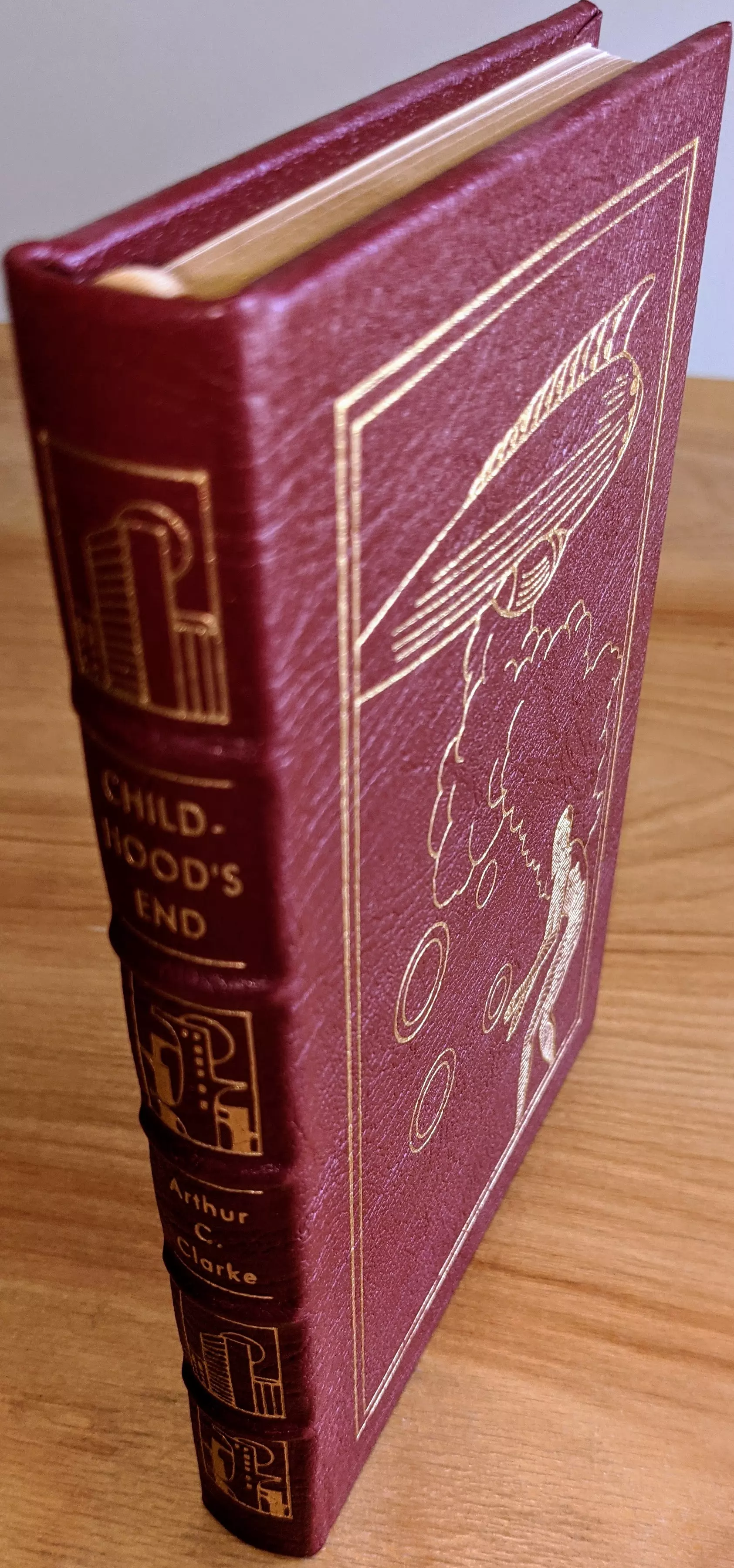 Stunning Red Leather Bound hardback book with hubbed spine, cover artwork in 22kt gold, printed on archival paper with gold gilded edges, smyth sewing & concealed muslin joints
	  - original artwork by Richard Powers