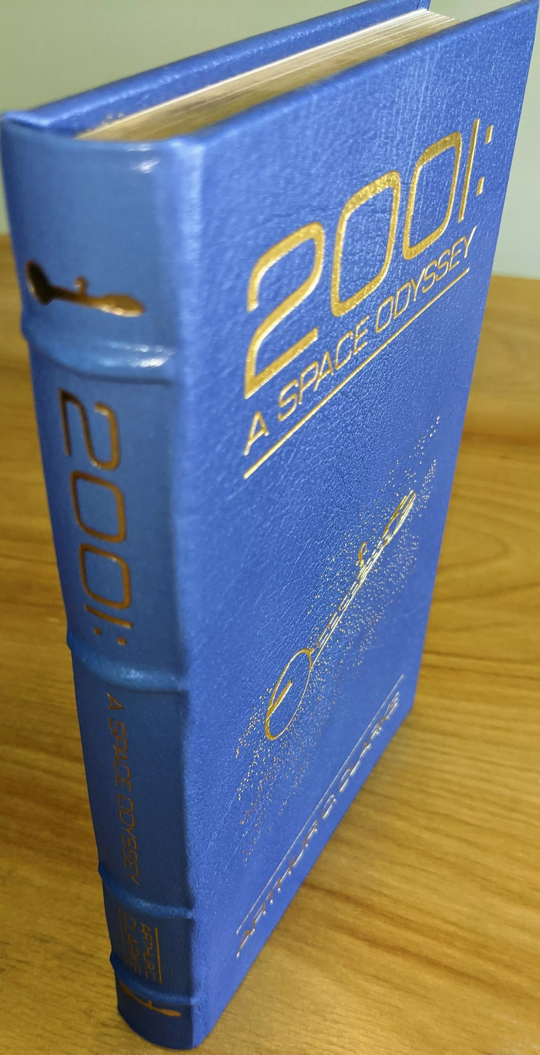 Stunning Blue Leather Bound hardback book with hubbed spine, cover artwork in 22kt gold, printed on archival paper with gold gilded edges, smyth sewing & concealed muslin joints
	  - original artwork by Vincent DiFate