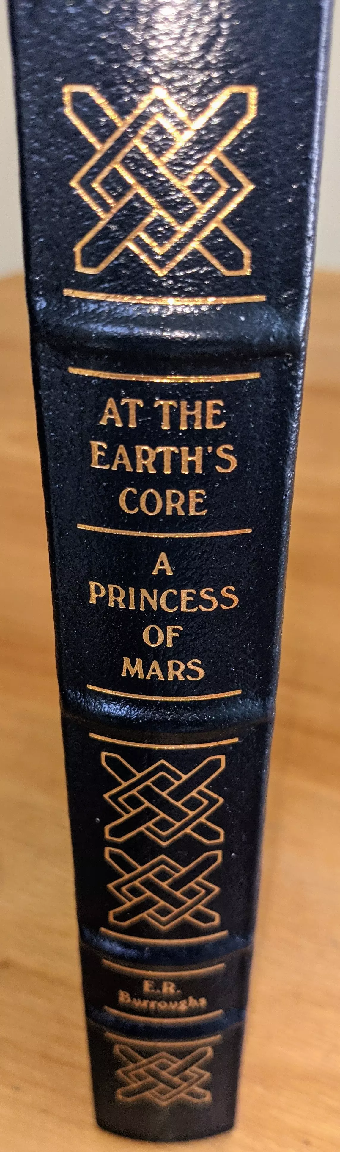Stunning Navy Blue Leather Bound hardback book with hubbed spine, cover artwork in 22kt gold, printed on archival paper with gold gilded edges, smyth sewing & concealed muslin joints
	  - original artwork by Ron Miller